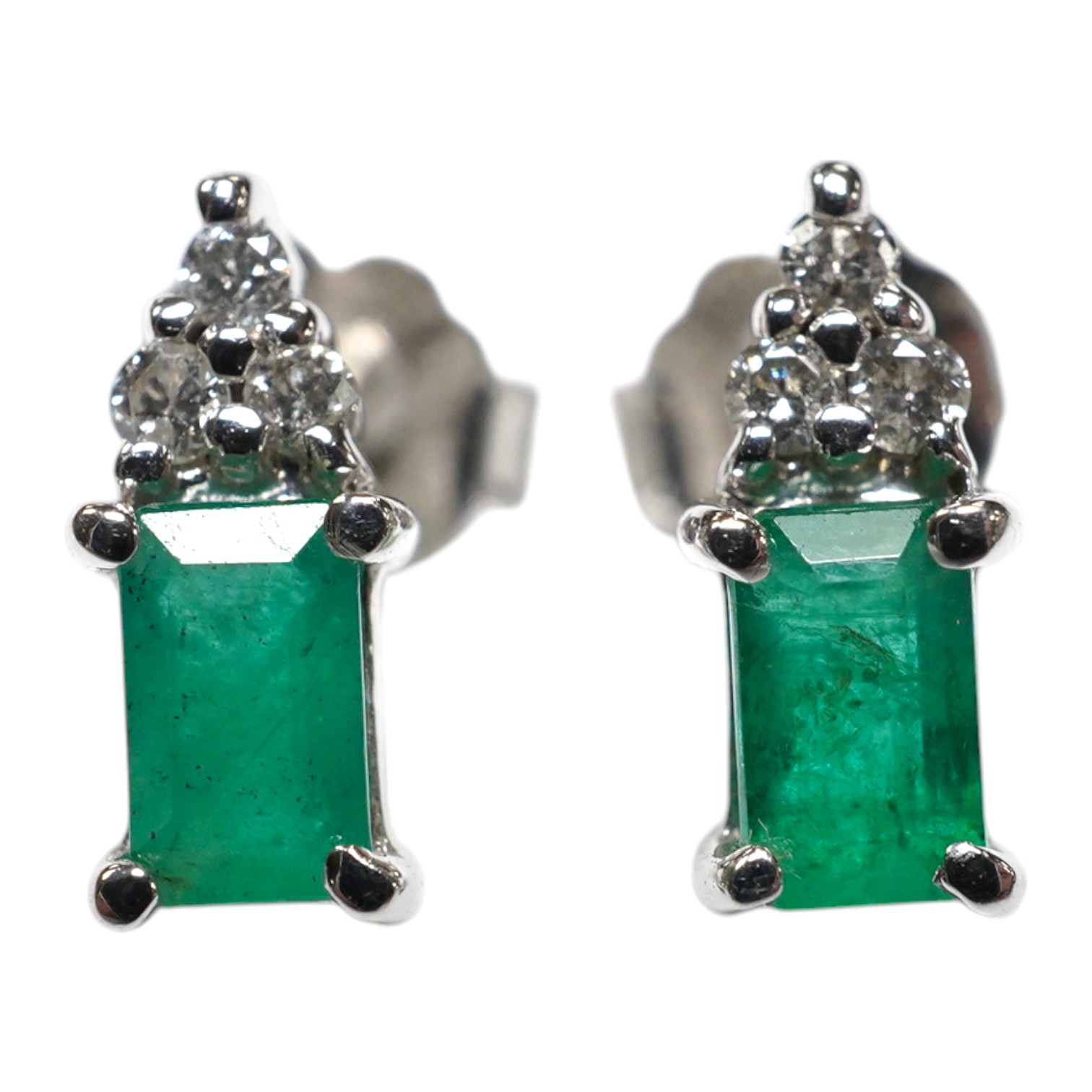 A small modern pair of 14k white metal, emerald and diamond cluster set ear studs, 9mm, gross weight 1.4 grams. Condition - good